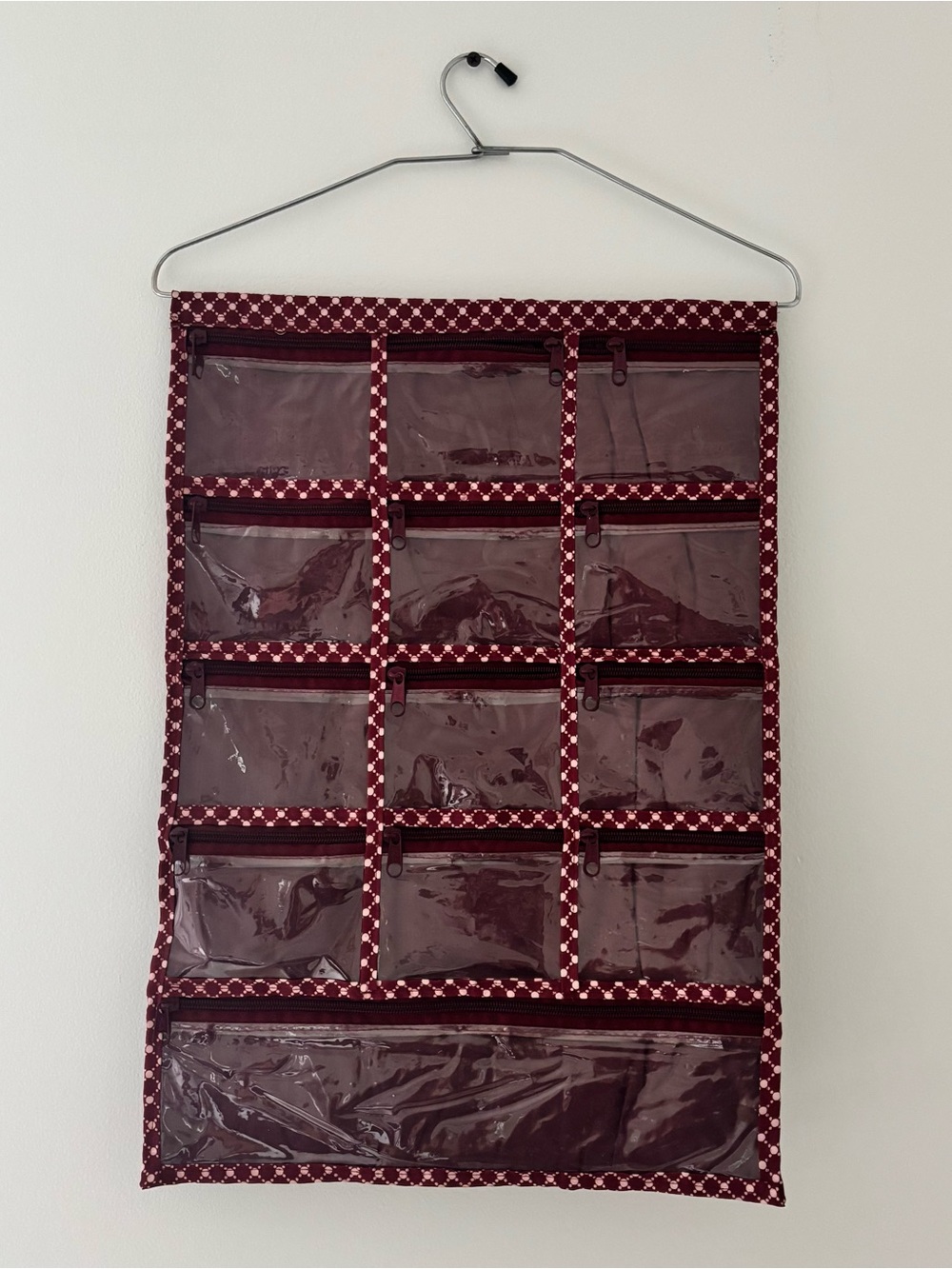Burgundy patterned hanger organizer with 13 pockets